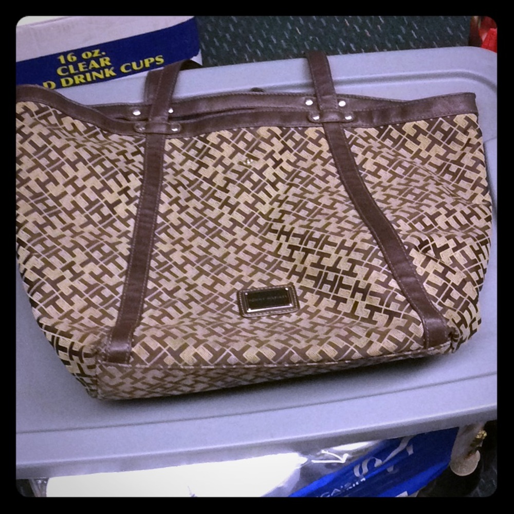 Tommy Hilfiger brown tote with “TH” all over bad